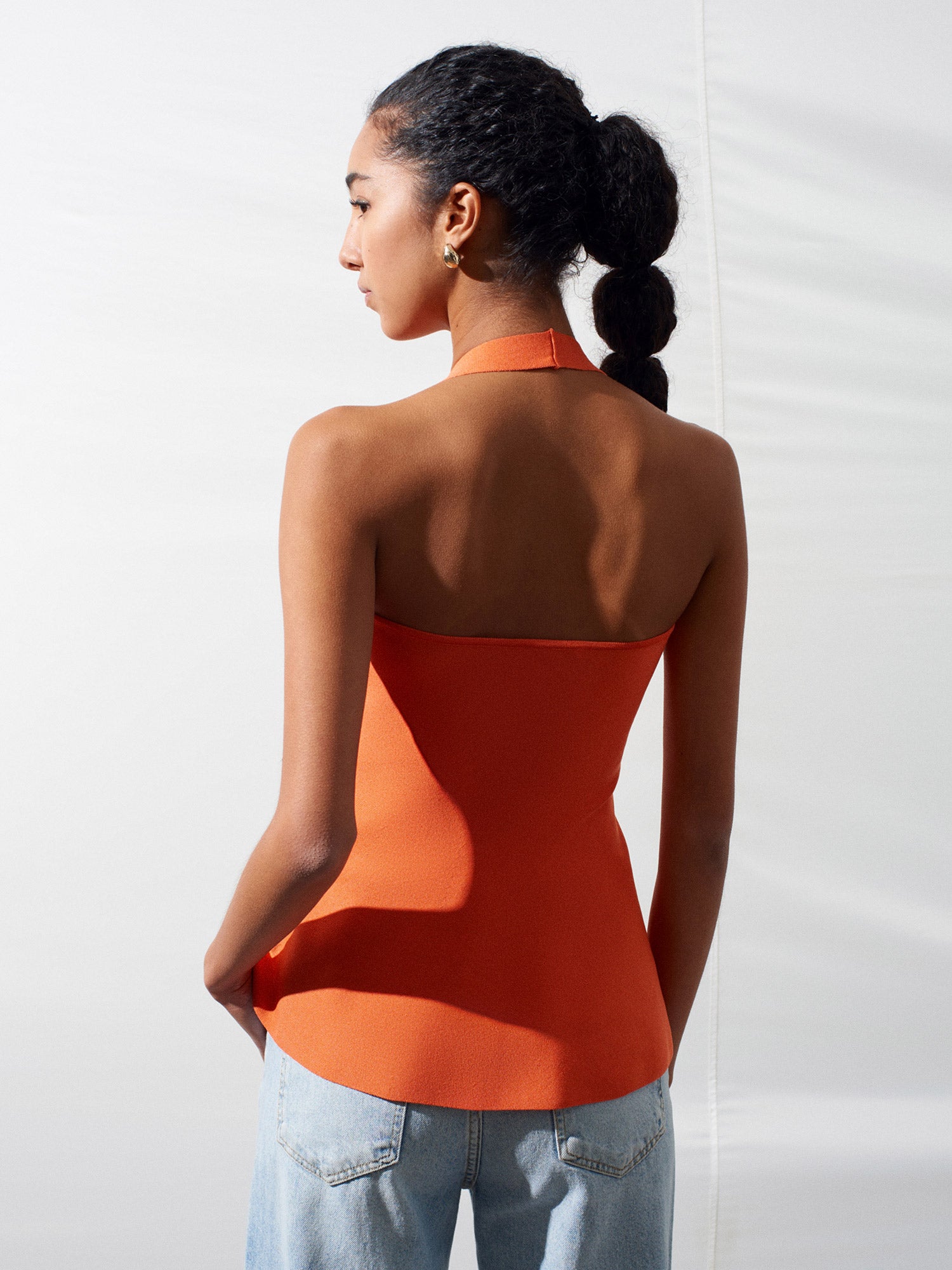 Peplumtopp i Stickat med Halterneck – Orange